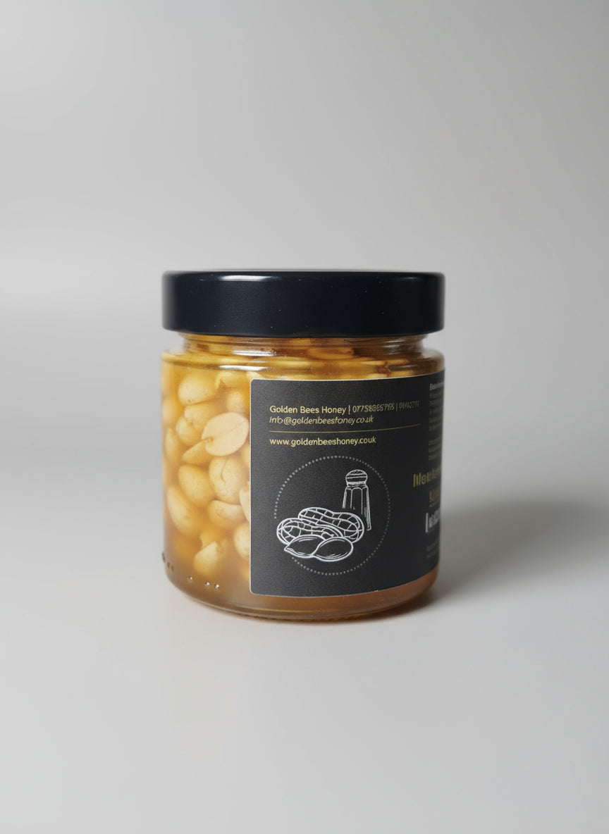 Jar of honey with a black lid on a kitchen counter