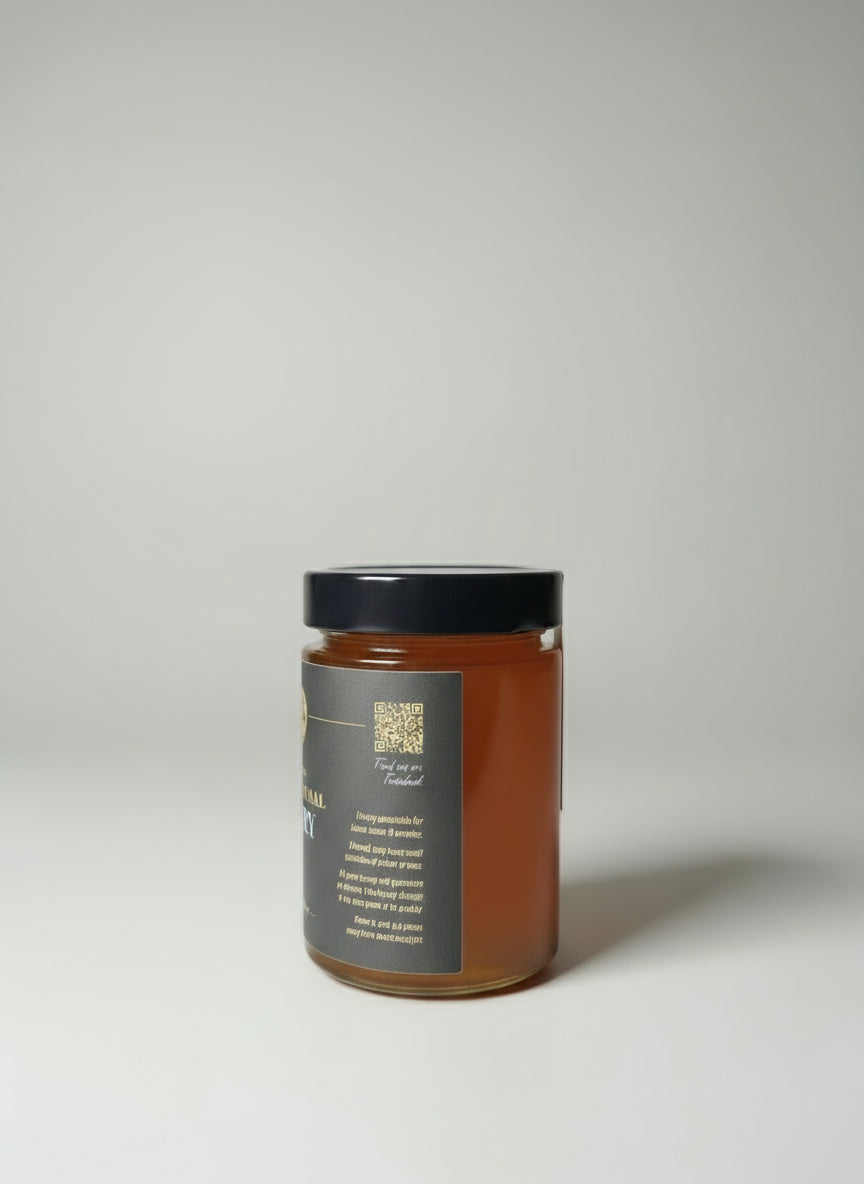 honey jar with black lid on a table
